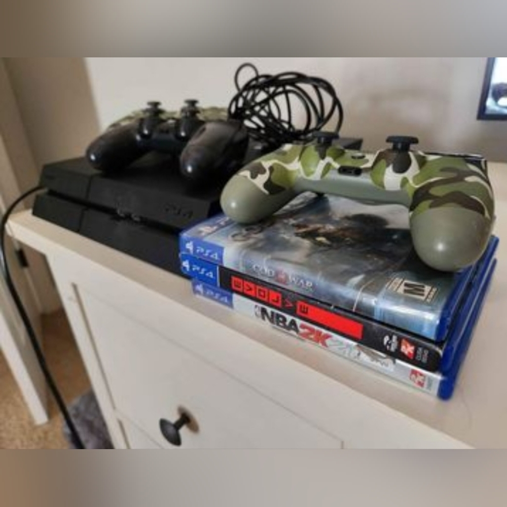 PS4 with games and cooling fan stand